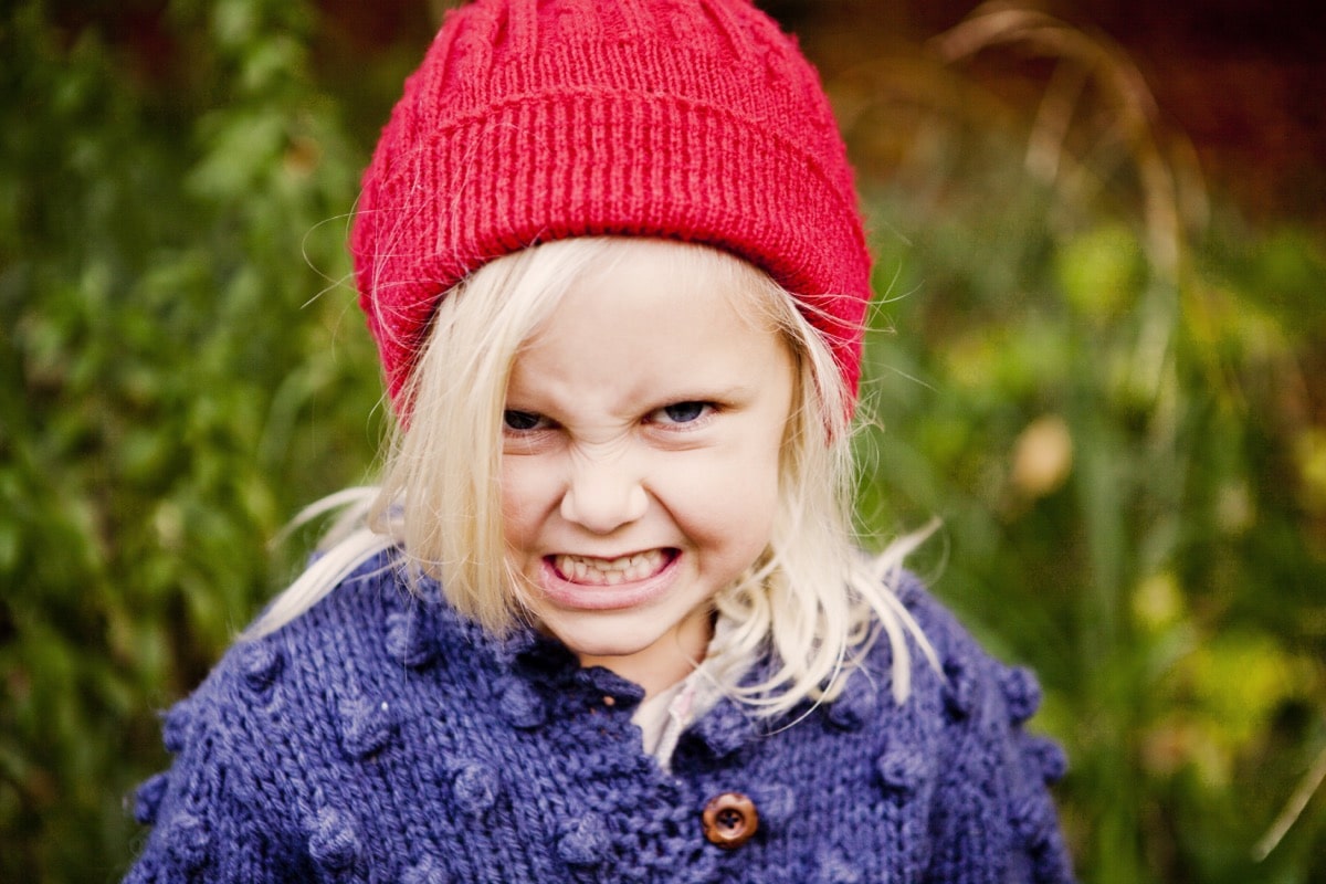 portrait of playful girl making face in forest 2021 08 29 00 59 18 utc portrait of playful girl making face in forest 2021 08 29 00 59 18 utc